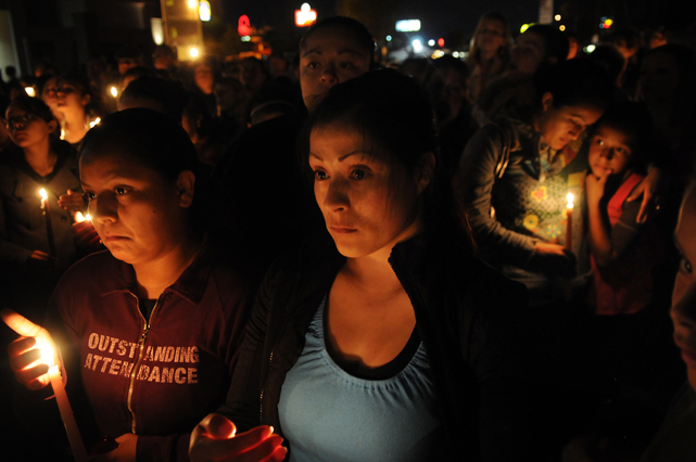 Pati Serrano, left, and Maria Lara, right, remember Sandra Cantu, 8, at a vigil in her memory in Tracy CA Tuesday April 7, 2009.